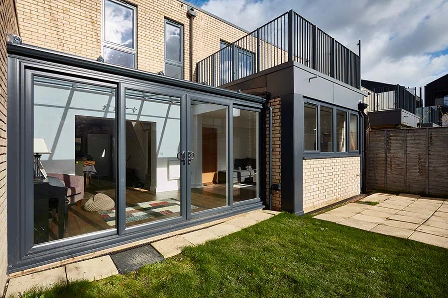 Dual anthracite grey uPVC lean to with French doors