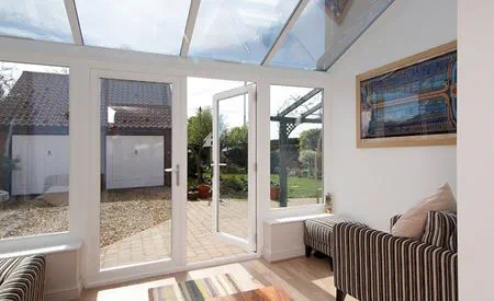 White PVCU Garden Room with garden view from French Doors