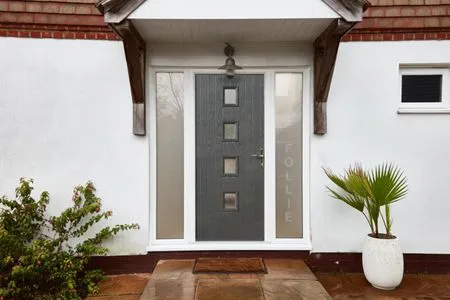 Contemporary GRP composite front door finished in Anthracite Grey from the Anglian composite doors range