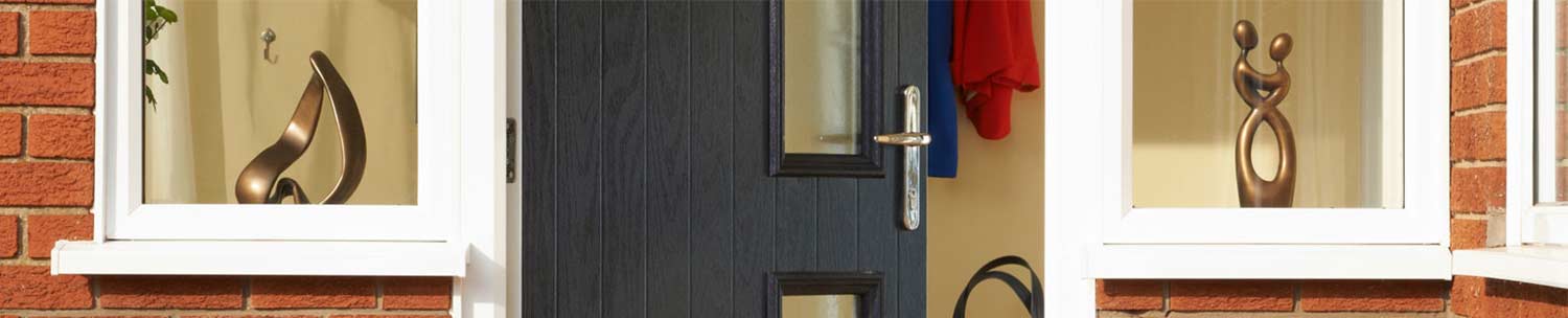 A sleek Palma GRP front door with a chrome door handle