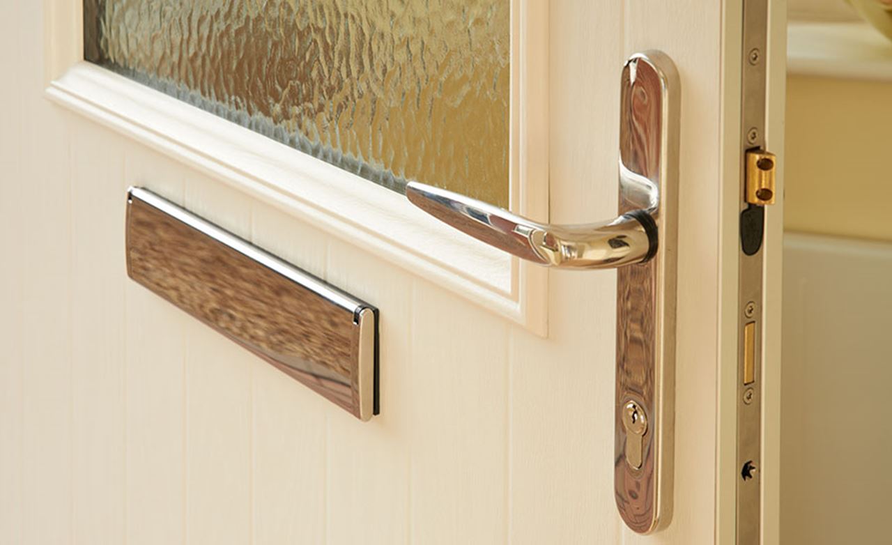 Chrome UPVC front door handle showing bolt locking mechanism from the Anglian secure front doors range