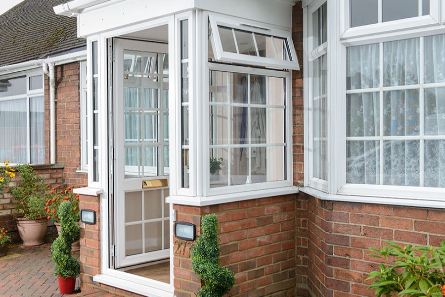 Open White UPVC front door porch and double glazed windows with Georgian bars from the Anglian porch range