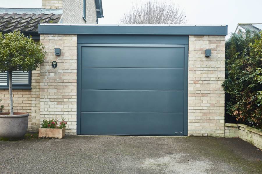 Steel sectional garage door in anthracite grey close up