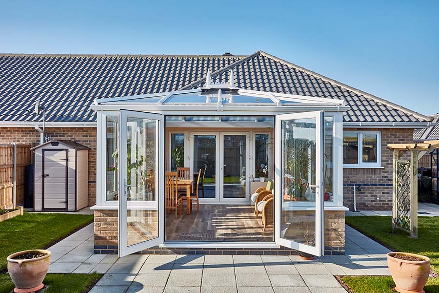 white upvc Edwardian conservatory with French doors in open position