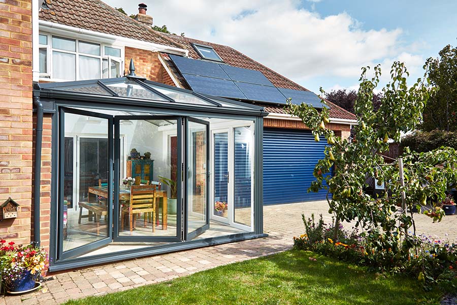 Dual Anthracite grey Eliabethan conservatory with bi-fold doors