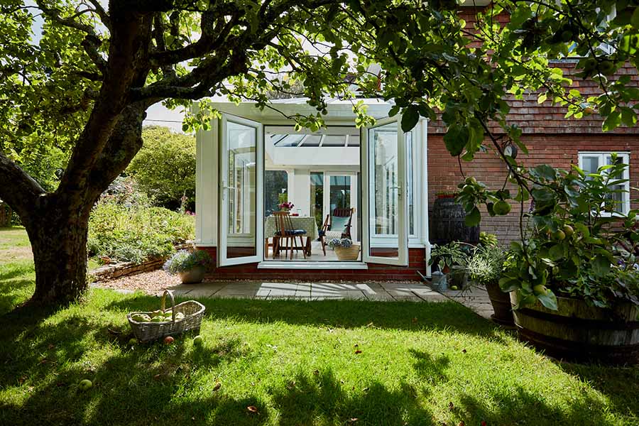 White uPVC Elizabethan conservatory with French doors front view