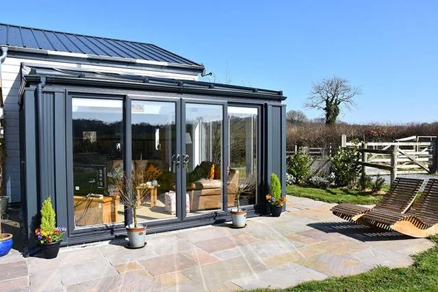 Anthracite grey solid panel roof extension with tilt and turn windows