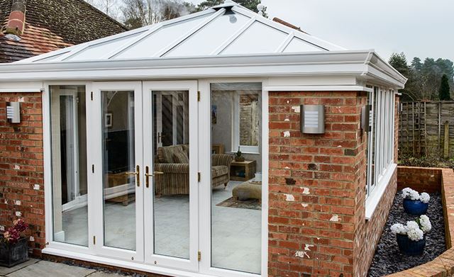 White brick orangery with French doors from Anglian Home UK