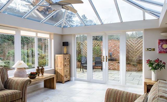 Interior view of White uPVC orangery lounge from Anglian Home UK