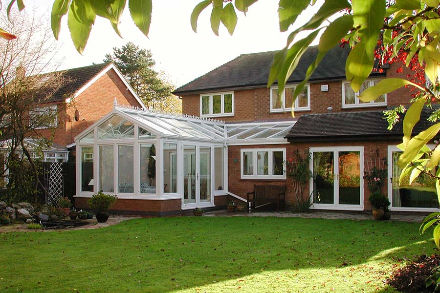 White uPVC harmony P-shaped conservatory with French doors