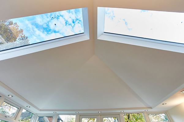 Close up interior view of glazed glass panels on a solid roof conservatory from the Anglian replacement solid conservatory roof range