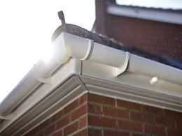Close up of white UPVC corner guttering from Anglian Home Improvements