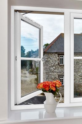 Inside view of timber flush casement window in white with monkey tail handle from the Anglian flush window range