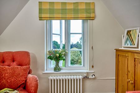 Secondary glazed horizontal sliding unit in open position living room interior
