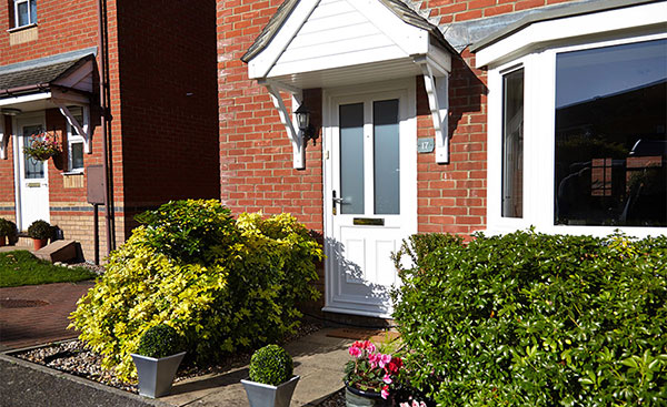 White uPVC front door and porch cladding from Anglian Home Improvements
