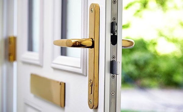 Close up of gold front door handle and locking mechanism from Anglian Home Improvements