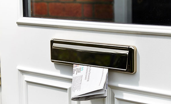 Close up of chrome letterbox door furniture from Anglian Home Improvements