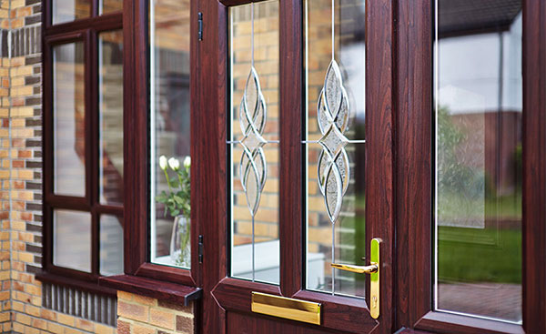 Close up of bevelled glass pattern on a UPVC front door finished in Dark Woodgrain