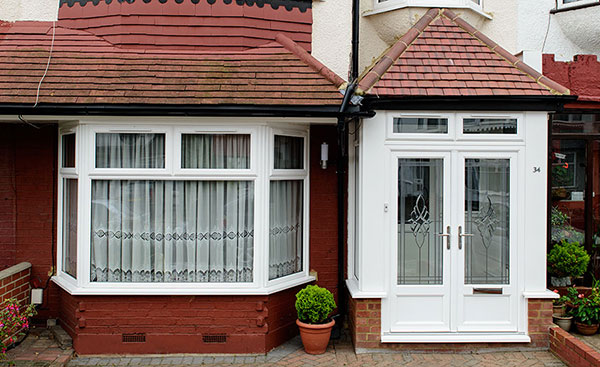 White UPVC front porch with French doors and decorative bevelled glass