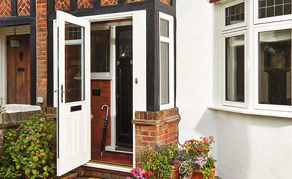 White UPVC front porch with wooden frame and double glazed glass