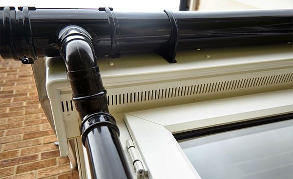 Guttering and downpipes made from Black uPVC from Anglian Home Improvements