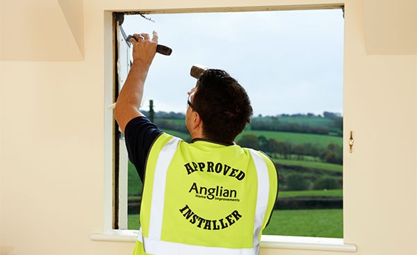 Removal of old window frame from home by Anglian Home Improvements
