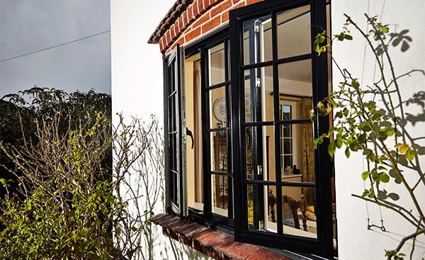 Timber cottage windows in Black from Anglian Home Improvements