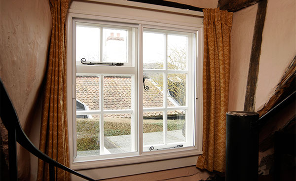 Hallway white secondary glazed window from Anglian Home Improvements