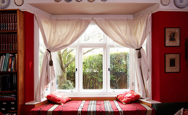 White secondary glazing on a living room window from Anglian Home Improvements