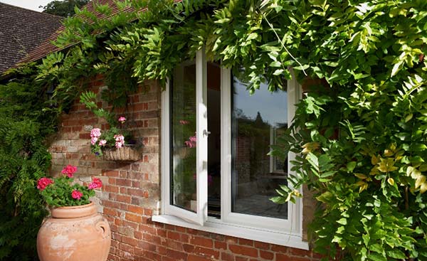 Exterior view of white uPVC window with triple glazing from Anglian Home Improvements