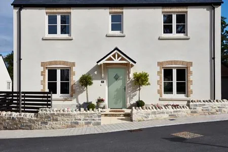 Whole house renovation with Sage Green cottage composite front door and Cream flush casement windows