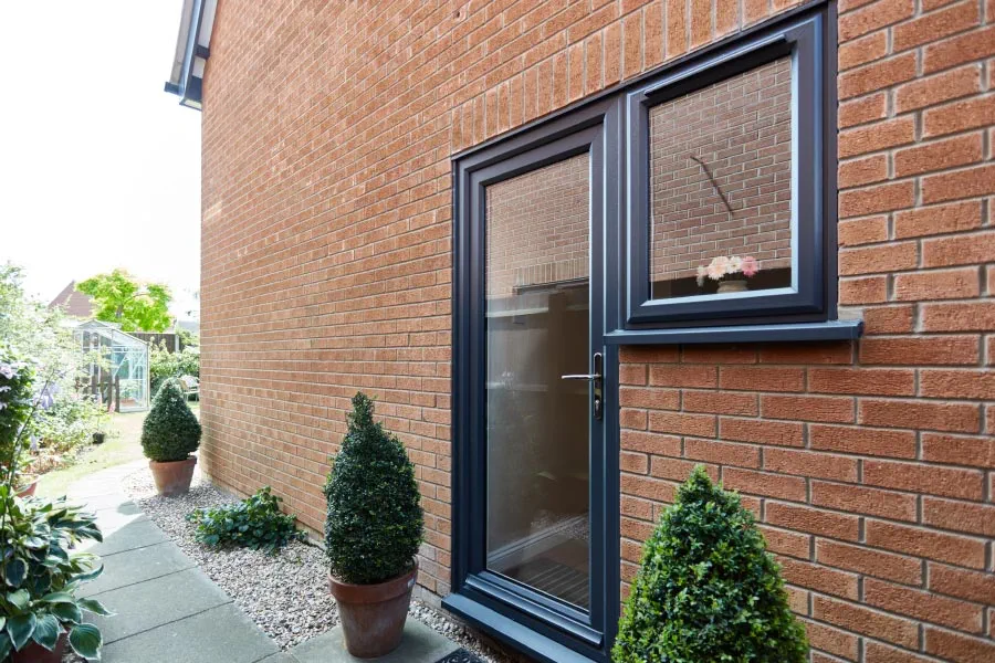 Anthracite Grey fully glazed back door with clear glass and matching grey casement window from the Anglian doors range