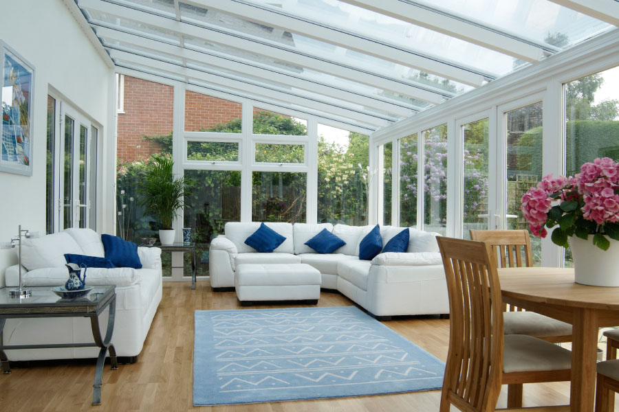 White uPVC Veranda Conservatory Interior with Living Room Furniture