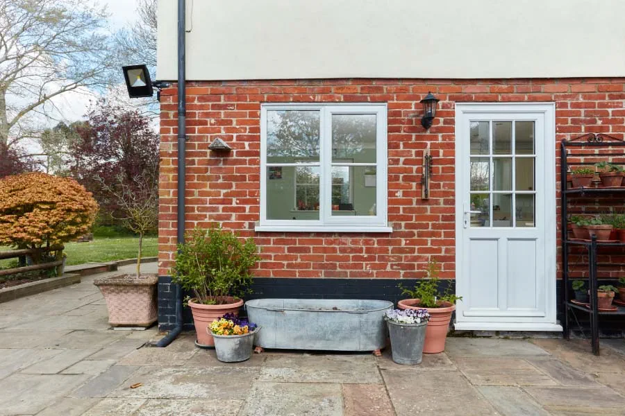 White uPVC Casement Window with White Back Door Exterior