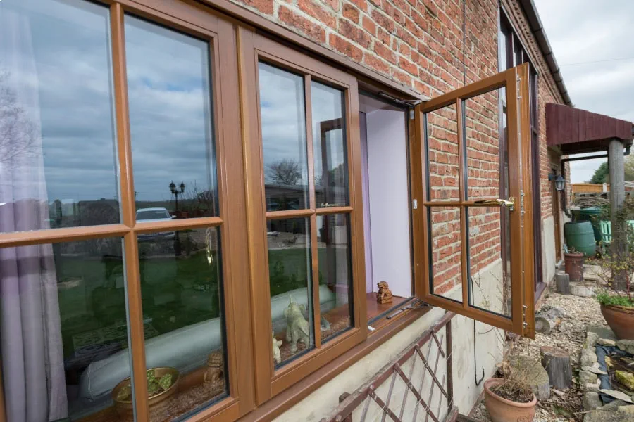 Golden Oak Wooden Casement Window with Cottage Bars In Open Position Exterior