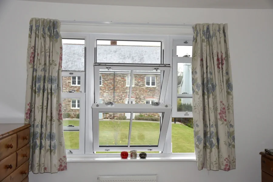 White uPVC Sash Window with Cottage Bars Interior in Tilt Position