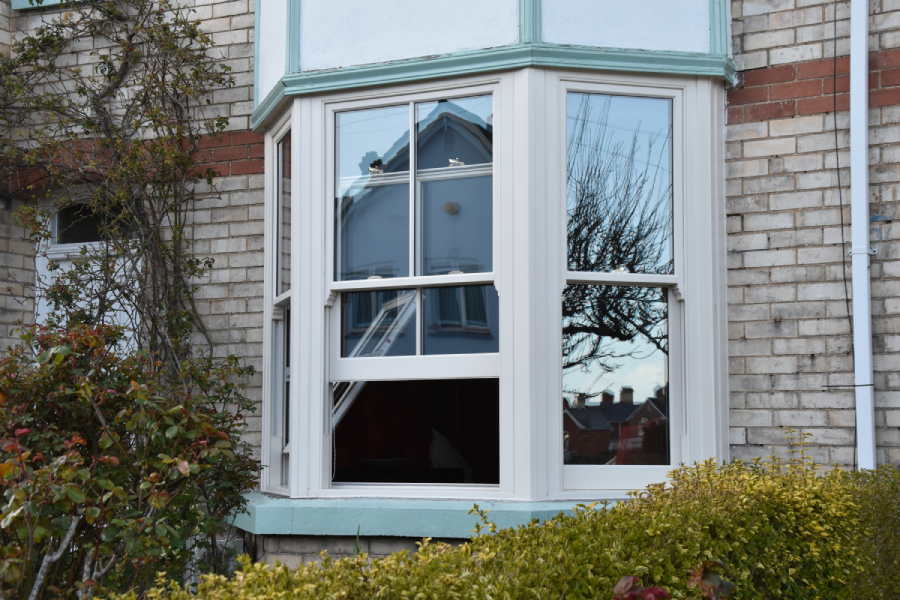 White uPVC Sliding Sash Window With Cottage Bars in Open Position
