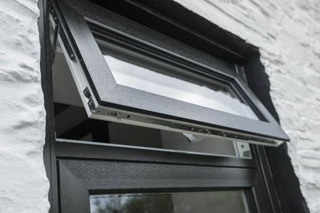 Close up of top hung casement on flush uPVC casement window in Black Ash from Anglian Home Improvements