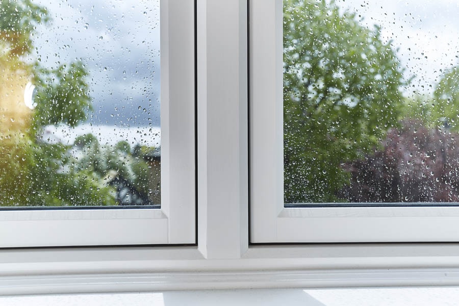 Close up of the interior of a White timber flush casement window from the Anglian wooden window range
