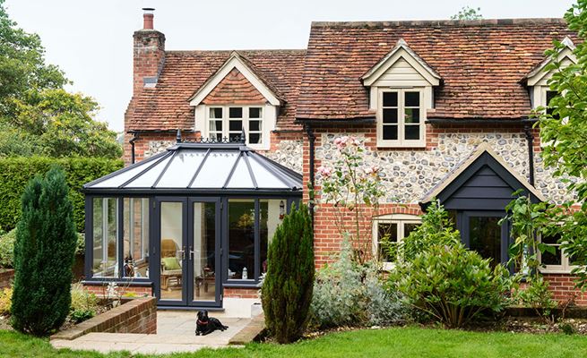 Anthracite Grey UPVC Edwardian conservatory with French doors and classic finials on period home from the Anglian conservatory range