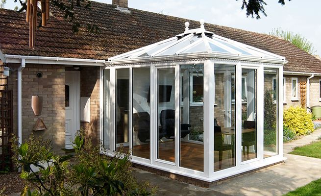 White UPVC Edwardian conservatory with full length windows and French doors from the Anglian conservatories range