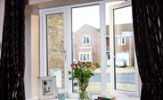 Double glazed UPVC casement windows finished in White Knight from the Anglian UPVC windows range