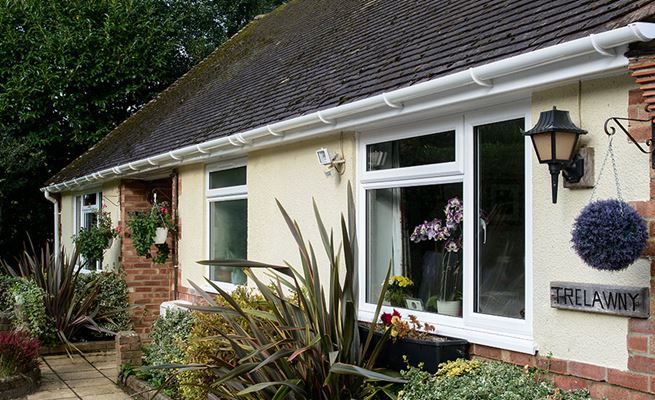 Bungalow with White Knight UPVC double glazed casement windows and guttering from Anglian Home Improvements