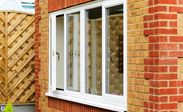 UPVC dining room double glazed window finished in White Knight from the Anglian casement window range