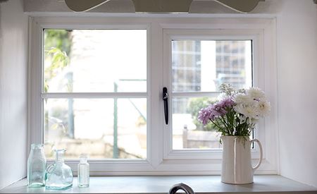 Wooden casement windows finished in White