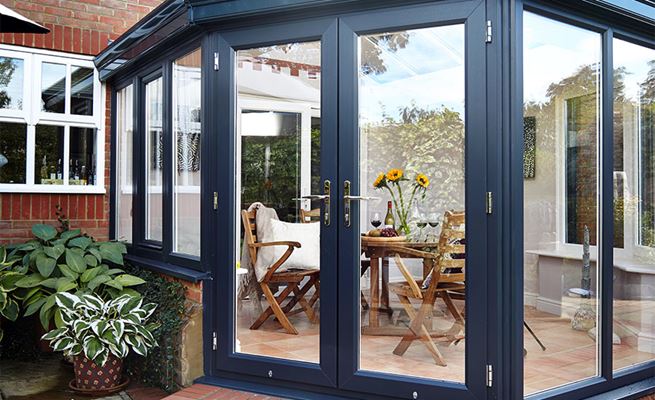 Dual colour Anthracite Grey and White uPVC French doors and windows on a Victorian style conservatory