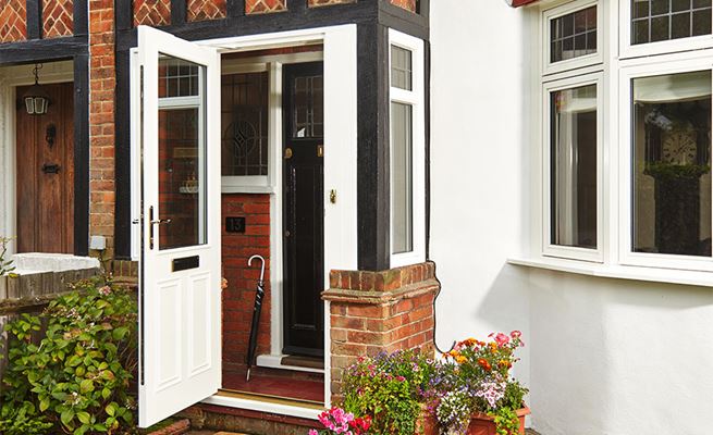 White wooden front door porch with gold letterbox and handle from the Anglian wooden front doors range