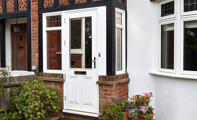 White wooden front door porch half double glazed with leaded side windows from the Anglian doors and porches range