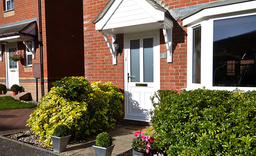 White uPVC Victorian style front door on a contemporary house from the Anglian uPVC front door range