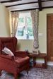 Interior view of Dual White and Sage Green UPVC double glazed casement windows with cottage bars from Anglian Home Improvements